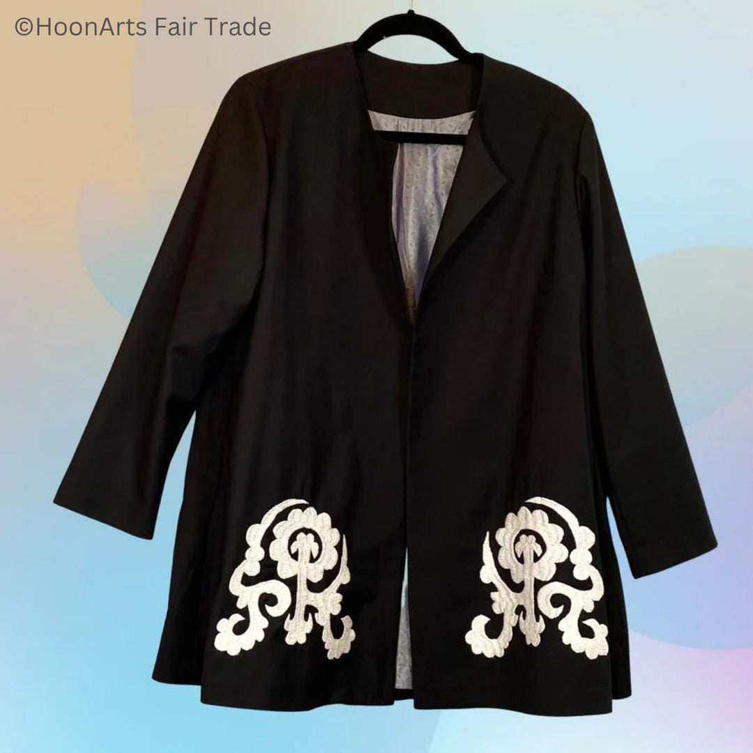 Black swing jacket with white hand-embroidered Suzani patterns, one on left front, one on right front